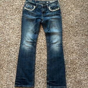 Women’s Miss Me Jeans.